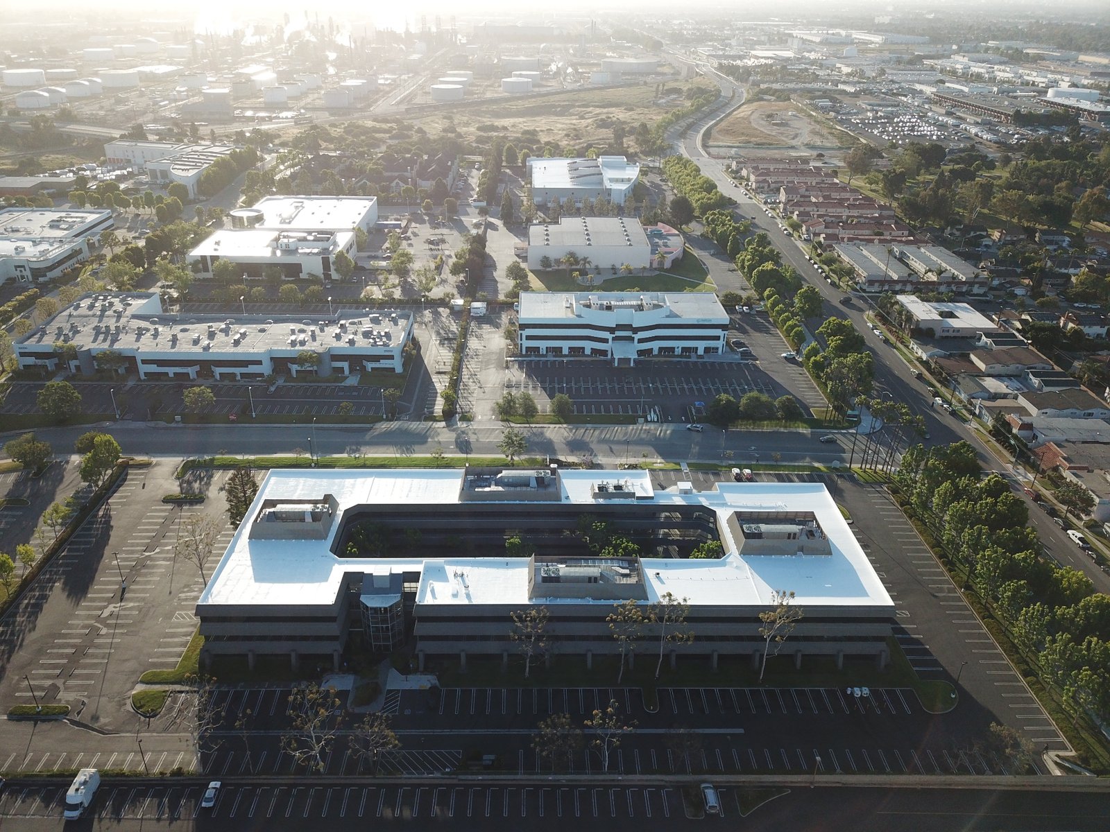 Aerial view of commercial buildings with flat and low-slope roofs
