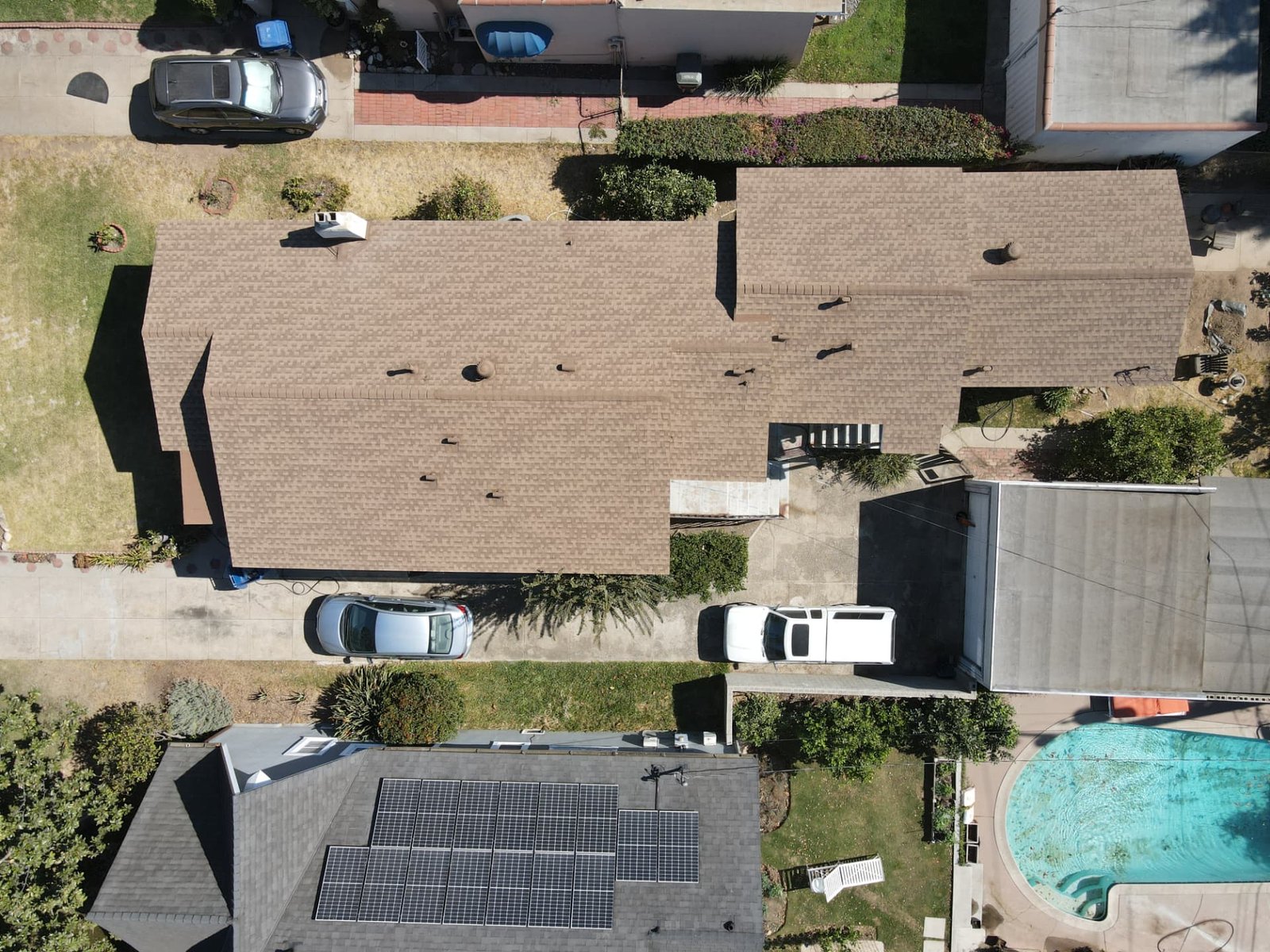 Top-down aerial of a residential asphalt shingle roof